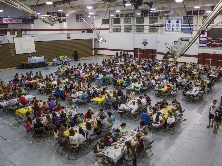 Large bingo hall full of players at tables