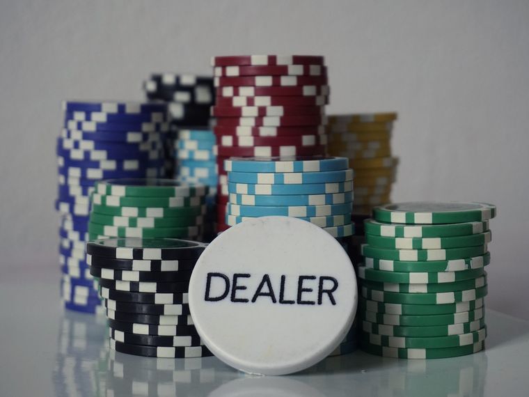 Chip stacks and a dealer button on a casino table