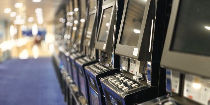 Row of slot machines on a casino floor